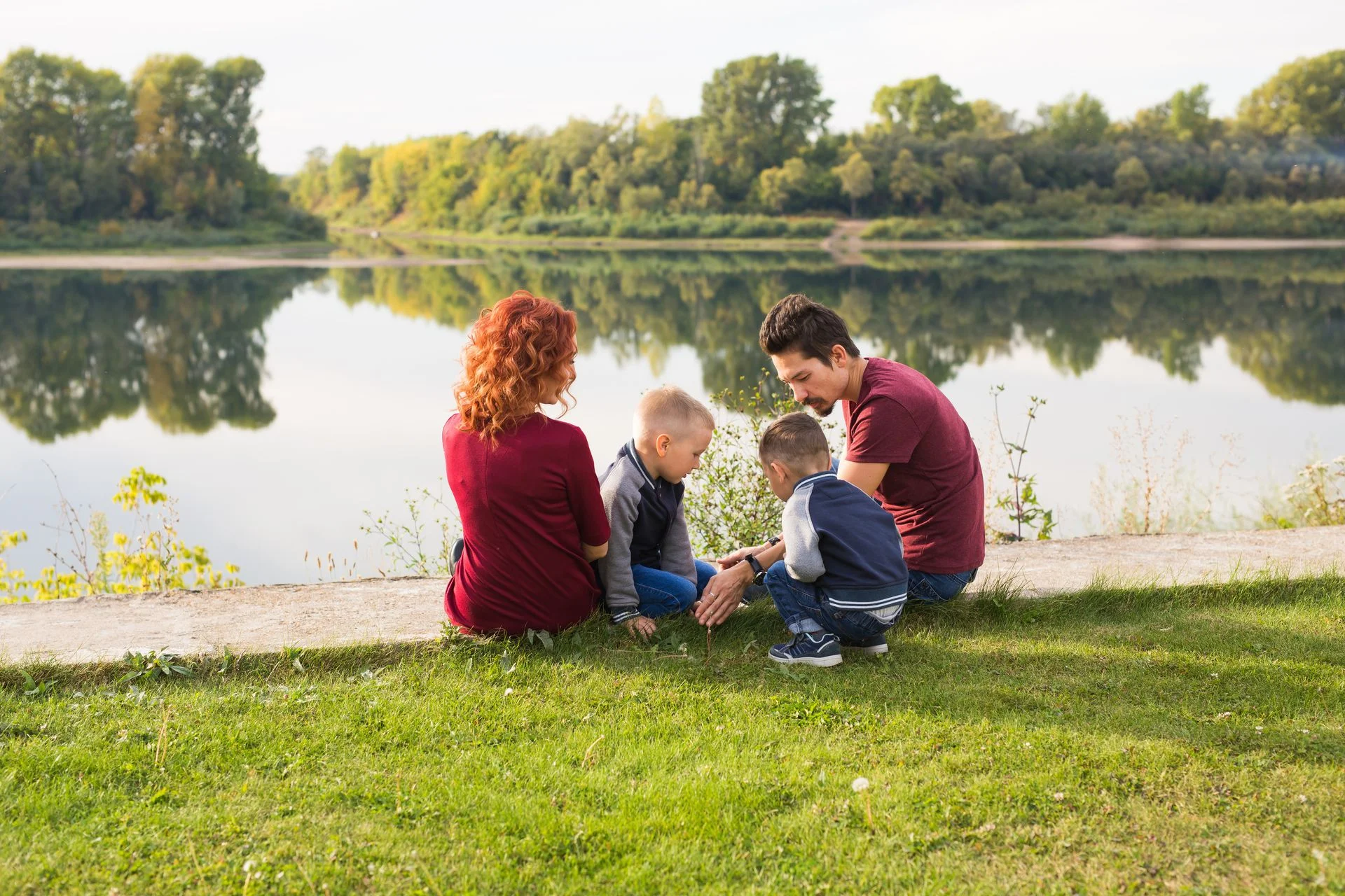 Family with children by the lake